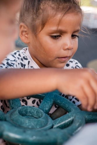 Young Aboriginal girl outside at preschool - Australian Stock Image