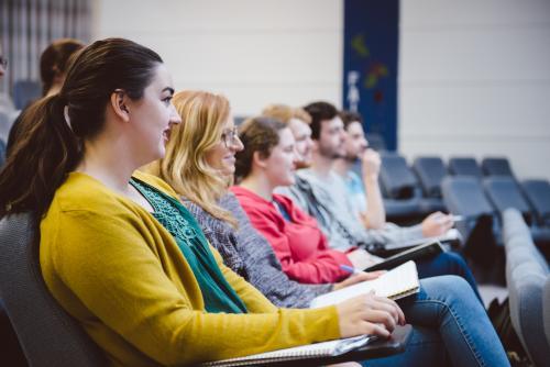 Young adult students in a university lecture hall