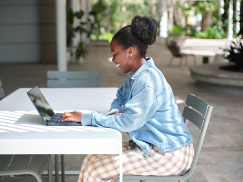 Young African woman using a computer on university campus