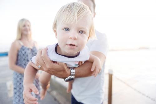 Young Boy being held in dads arms up - Australian Stock Image