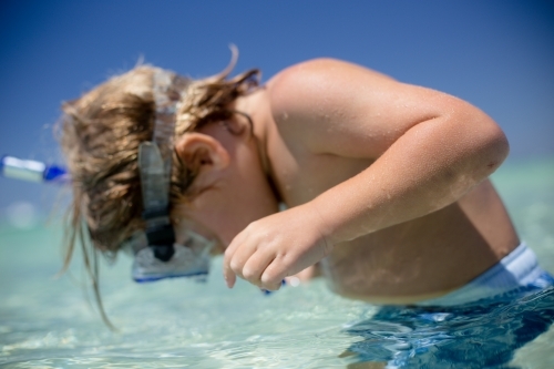 Young boy snorkeling - Australian Stock Image