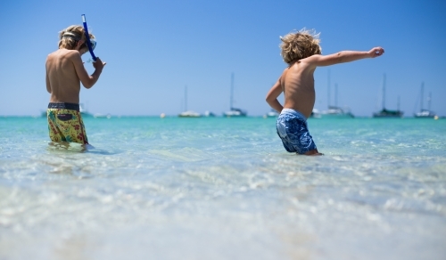 Young boys playing at beach - Australian Stock Image