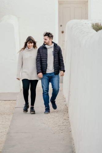 Young couple walking outdoors. - Australian Stock Image