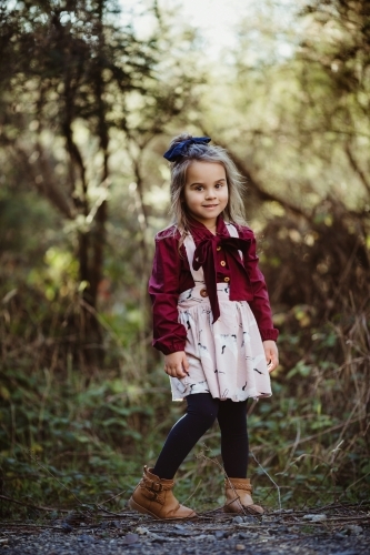 Young fashionable girl standing in bush setting - Australian Stock Image