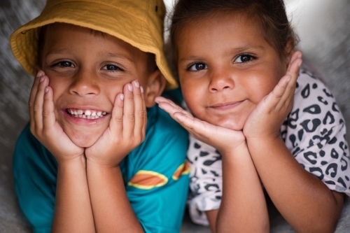 Young First Nations girl and boy playing together in a tunnel - Australian Stock Image