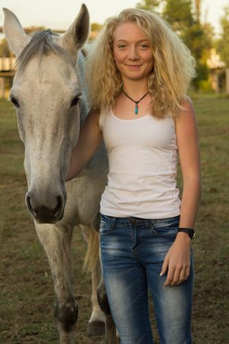 Young girl standing with her horse - Australian Stock Image