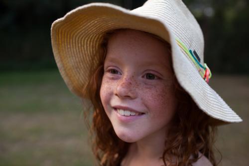 Young girl wearing a floppy hat - Australian Stock Image