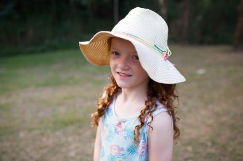 Young girl wearing a floppy hat - Australian Stock Image