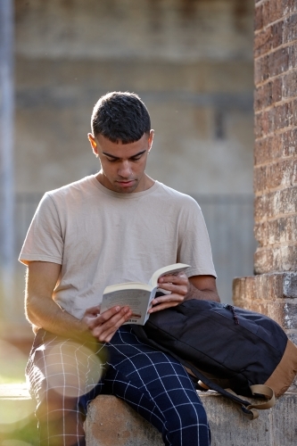 Young Indigenous Australian man enjoying time outdoors - Australian Stock Image