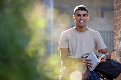 Young Indigenous Australian man enjoying time outdoors - Australian Stock Image