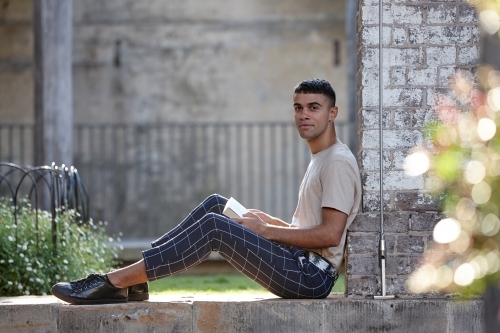 Young Indigenous Australian man enjoying time outdoors - Australian Stock Image