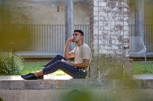 Young Indigenous Australian man enjoying time outdoors - Australian Stock Image