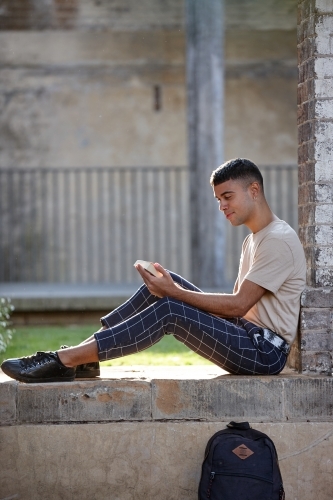 Young Indigenous Australian man enjoying time outdoors - Australian Stock Image