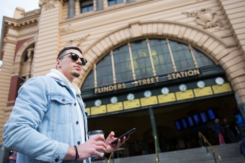 Young Man Waiting Outside Flinders Street Station - Australian Stock Image