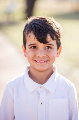 Young mixed race Aboriginal and Caucasian boy smiling - Australian Stock Image