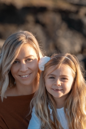 Young mother and daughter portrait at sunrise - Australian Stock Image