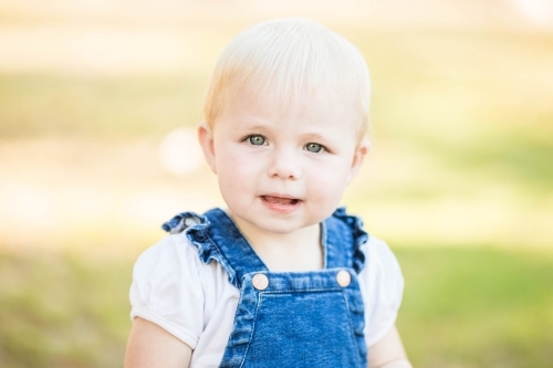 Young toddler girl looking at camera - Australian Stock Image