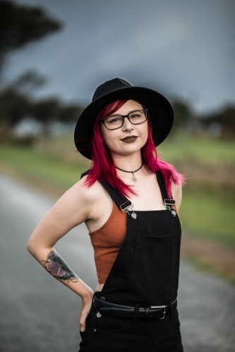 Young woman standing with hands on hips - Australian Stock Image